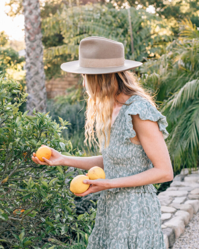 woman picking lemons 865x1081