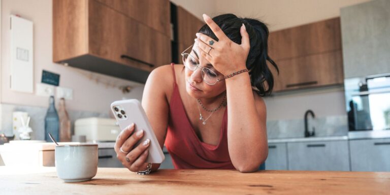 woman sad on phone