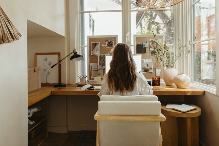 camille styles working at desk