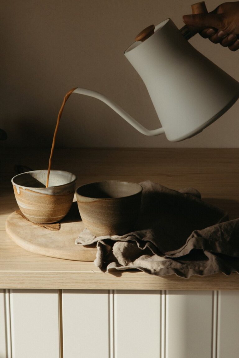 woman pouring chai 865x1296