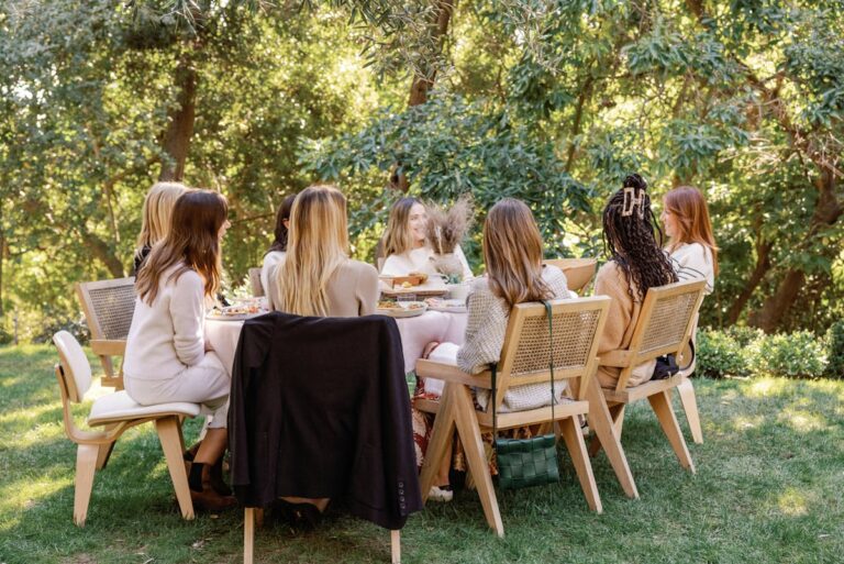 women seated at outdoor table